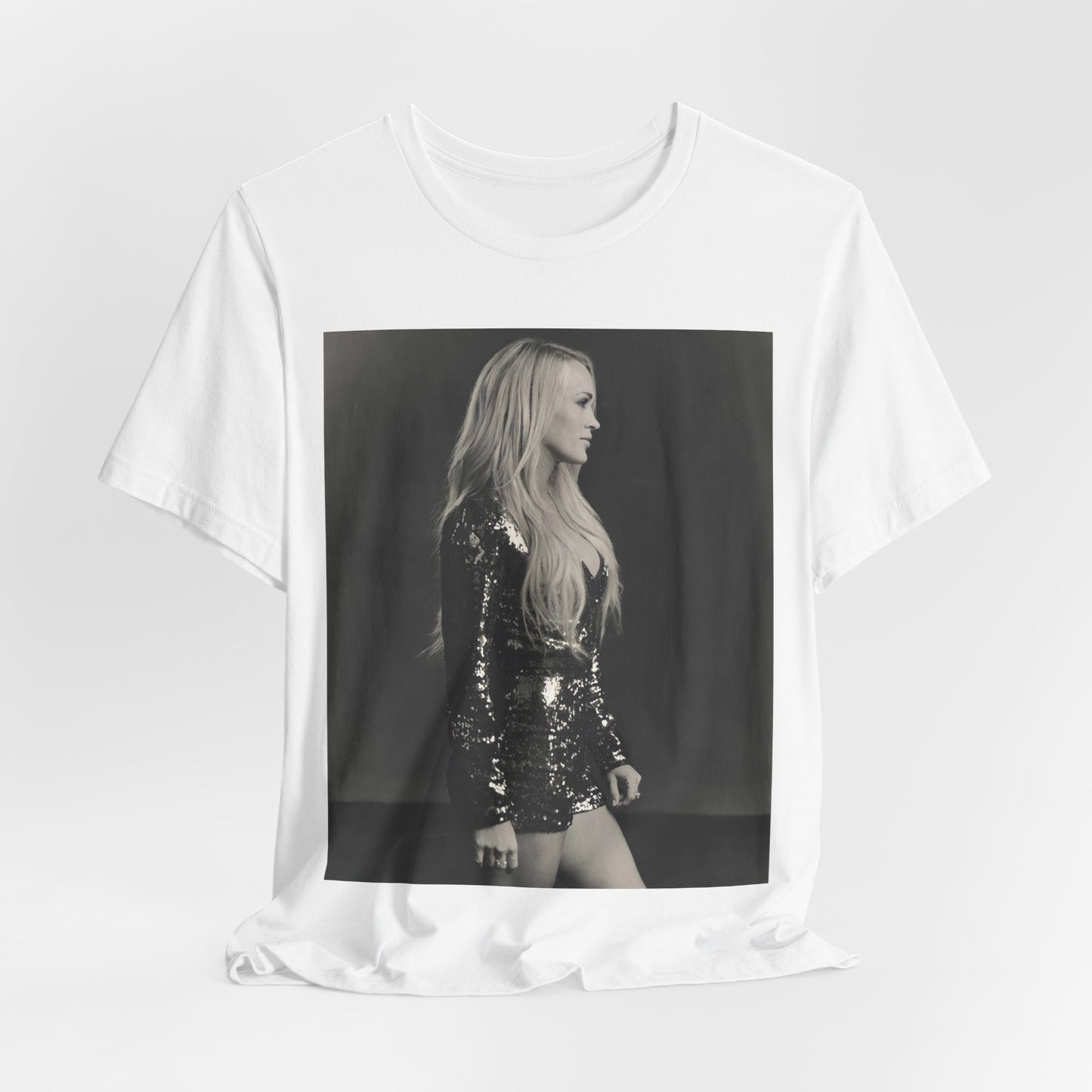 A black graphic t-shirt featuring a black and white photo of Carrie Underwood performing live on stage.