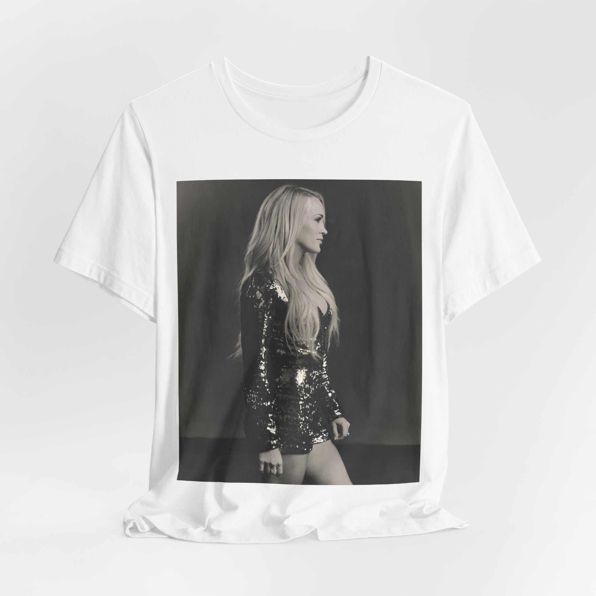 A black graphic t-shirt featuring a black and white photo of Carrie Underwood performing live on stage.