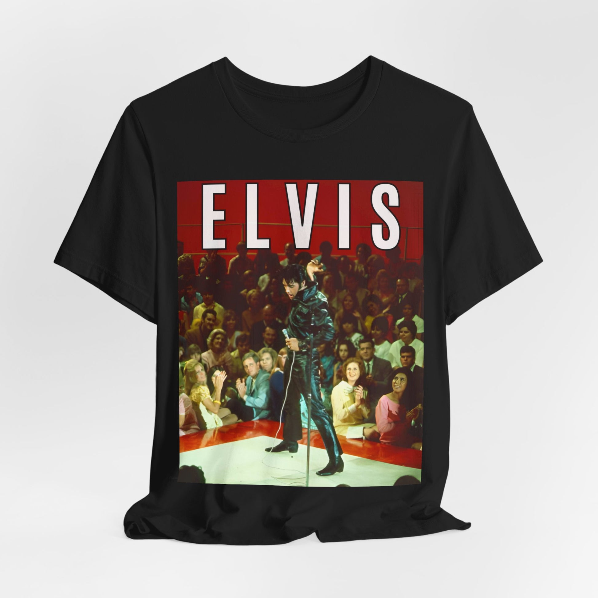 A black graphic t-shirt featuring a retro graphic related to an Elvis Presley special concert.