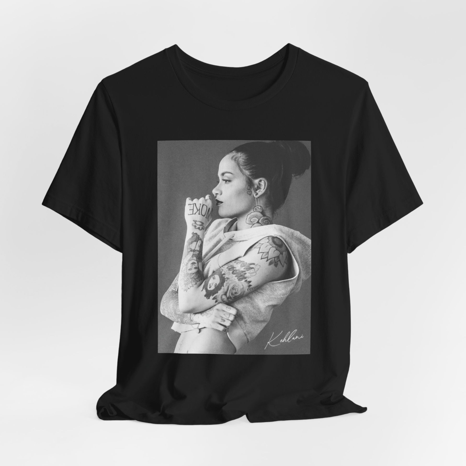 A black graphic t-shirt featuring a black and white, monochrome graphic or photo of Kehlani.