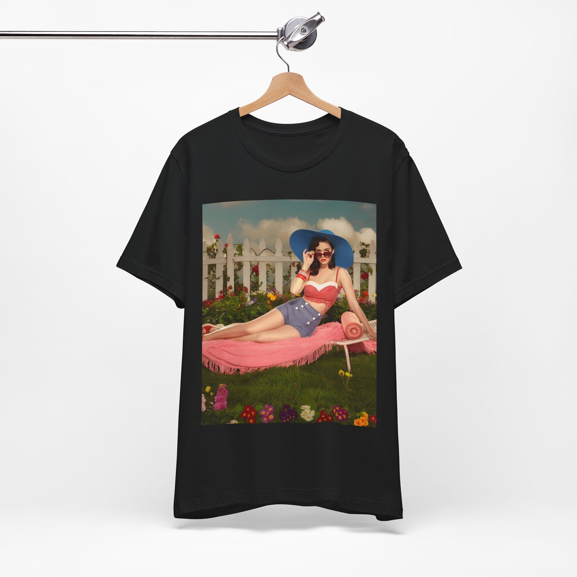 A black graphic t-shirt featuring a graphic related to Katy Perry's "California Gurls" song, with beach vibes.