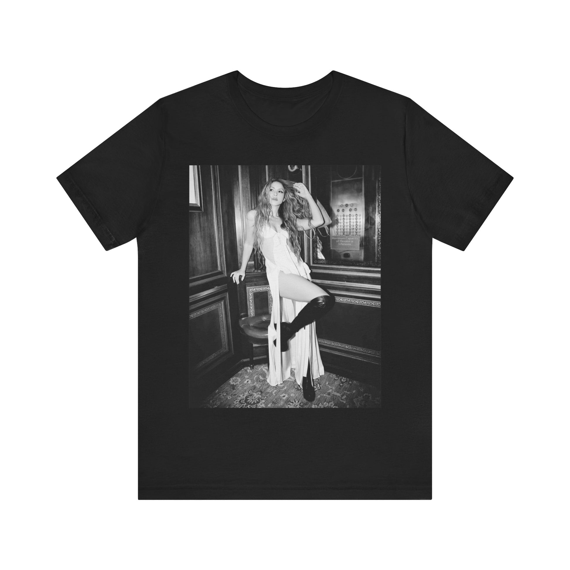A black graphic t-shirt featuring a retro black and white monochrome graphic or photo of Shakira.