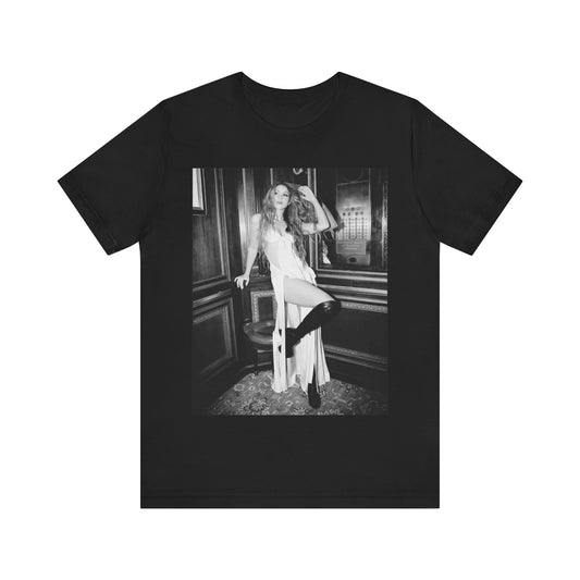 A black graphic t-shirt featuring a retro black and white monochrome graphic or photo of Shakira.