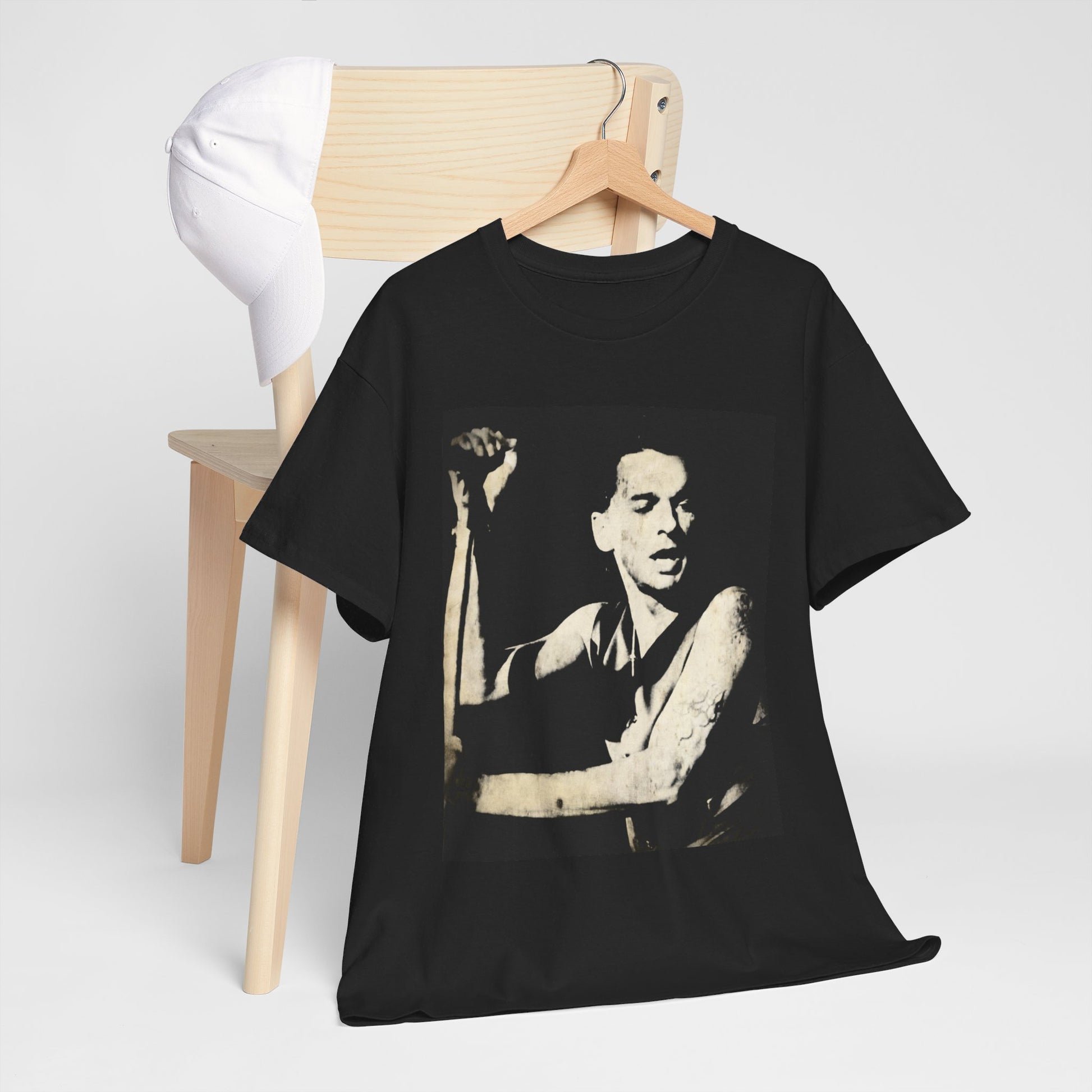 A black graphic t-shirt featuring a black and white graphic or photo of Depeche Mode performing live on stage.