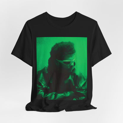 A black graphic t-shirt featuring a vintage graphic related to The Weeknd's 'Kiss Land' era.