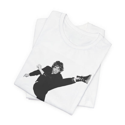 A black graphic t-shirt featuring a retro graphic related to INXS's 'Kick' album era.