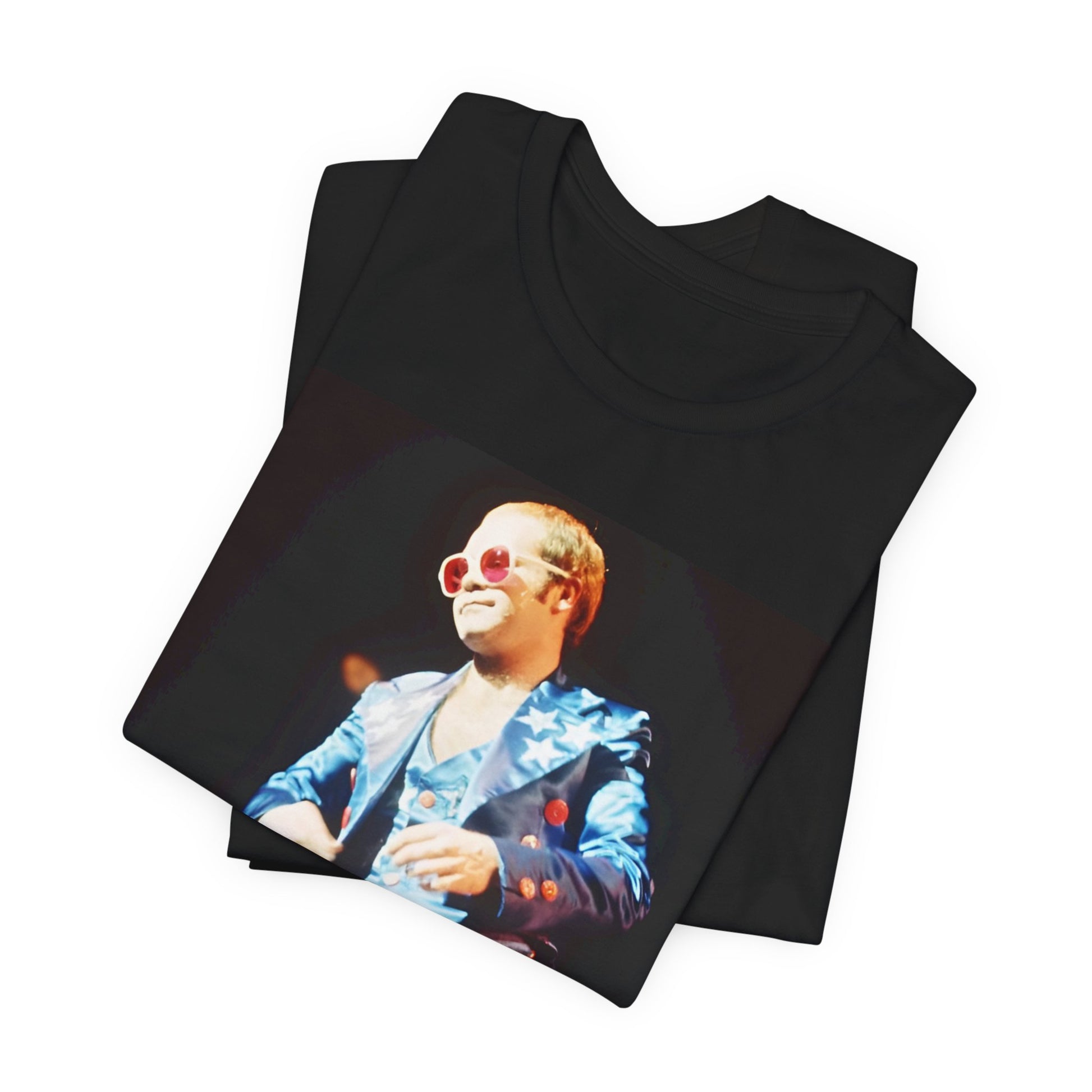 A black graphic t-shirt featuring a graphic related to Elton John's 70s America tour.