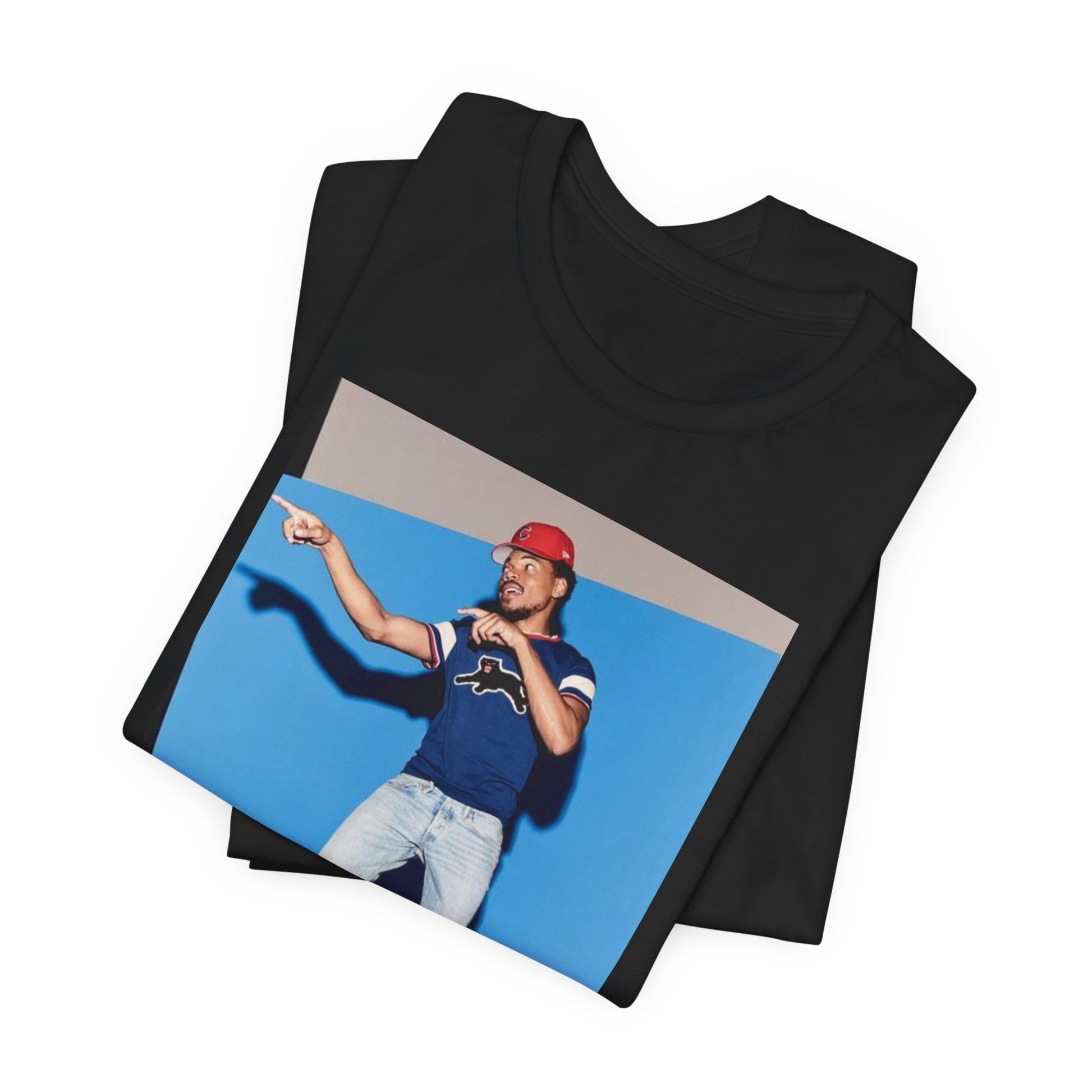 A black graphic t-shirt featuring a graphic of Chance the Rapper emphasizing his gospel rap style.