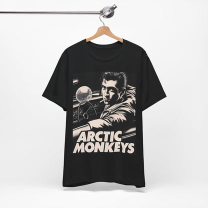 A black graphic t-shirt featuring a graphic of Arctic Monkeys from the 2000s, evoking an indie rock aesthetic.