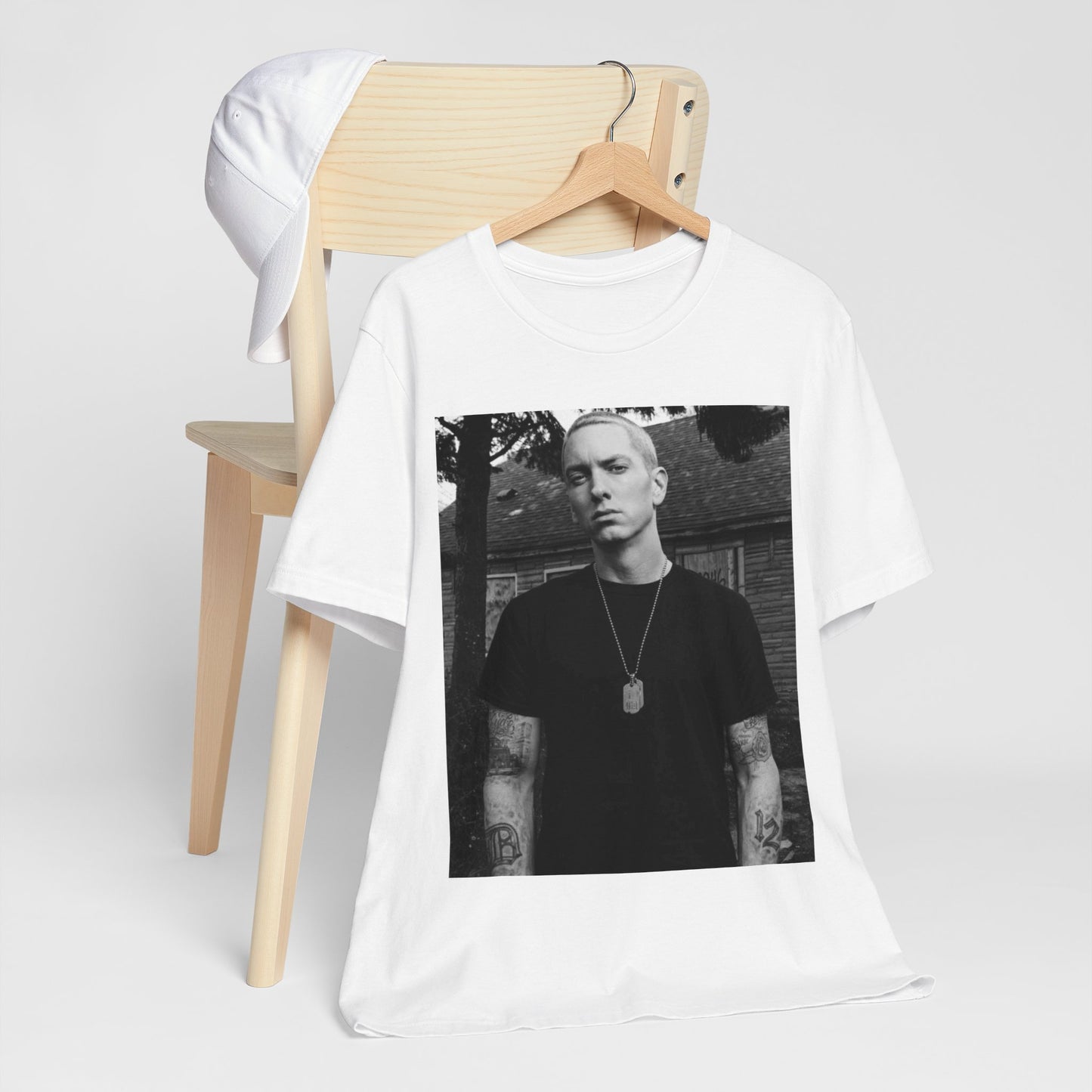 A black graphic t-shirt featuring a black and white graphic of Eminem as Slim Shady.