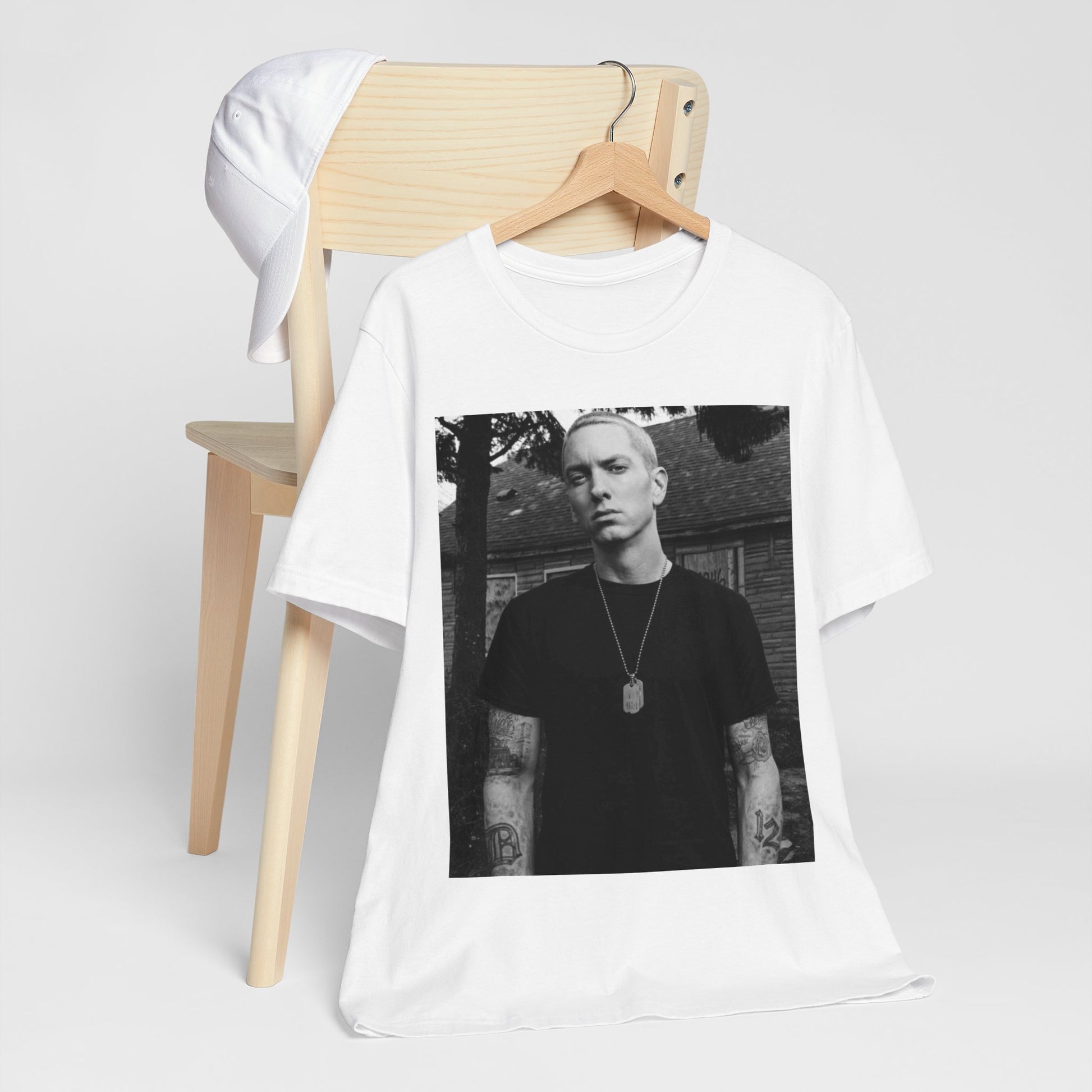 A black graphic t-shirt featuring a black and white graphic of Eminem as Slim Shady.
