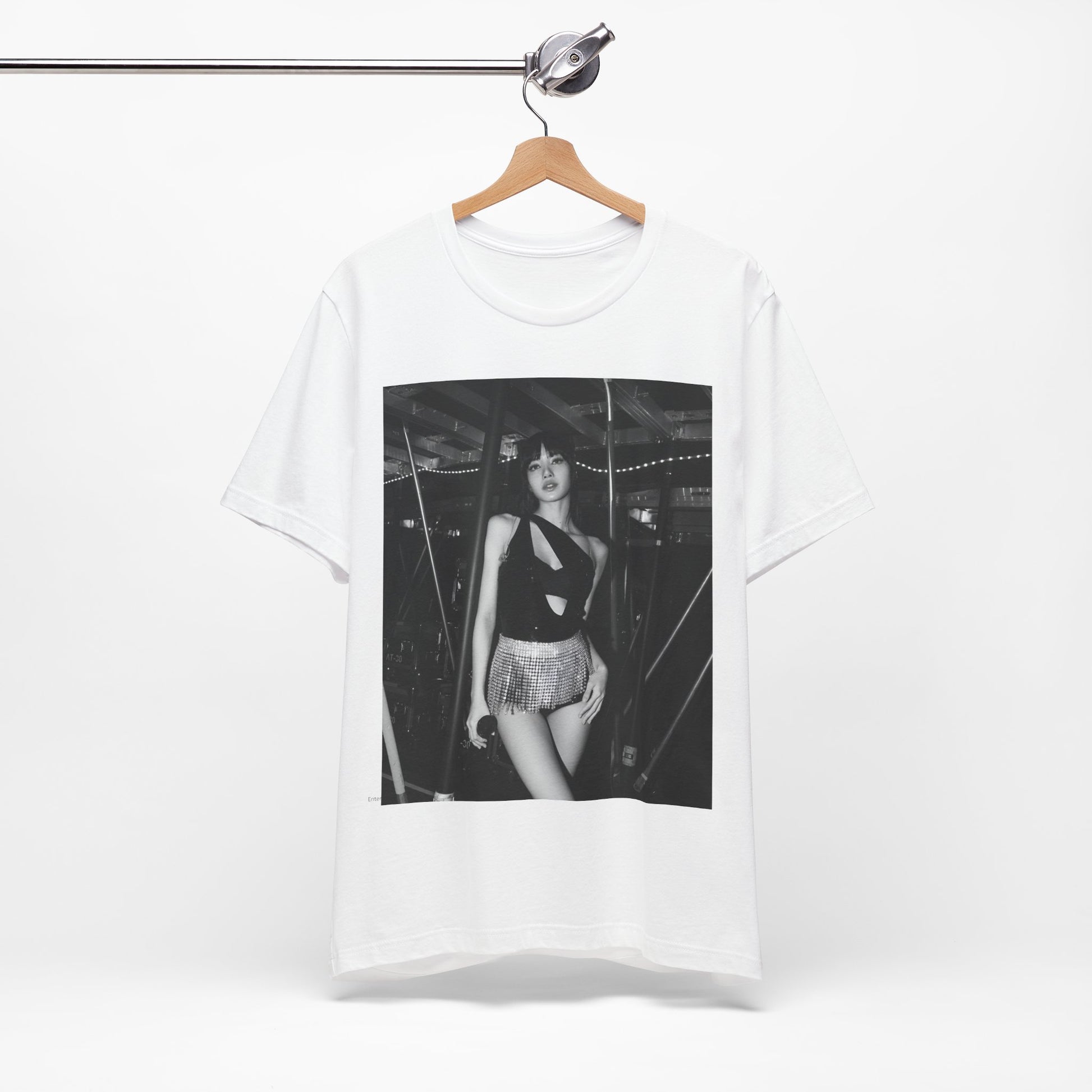 A black graphic t-shirt featuring a black and white graphic or photo of Lisa in a backstage setting.