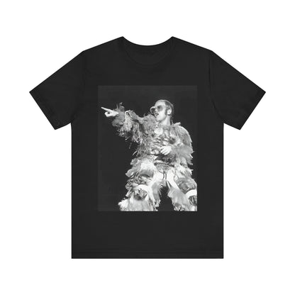 A black graphic t-shirt featuring a retro graphic of Elton John as a rock legend performing live.