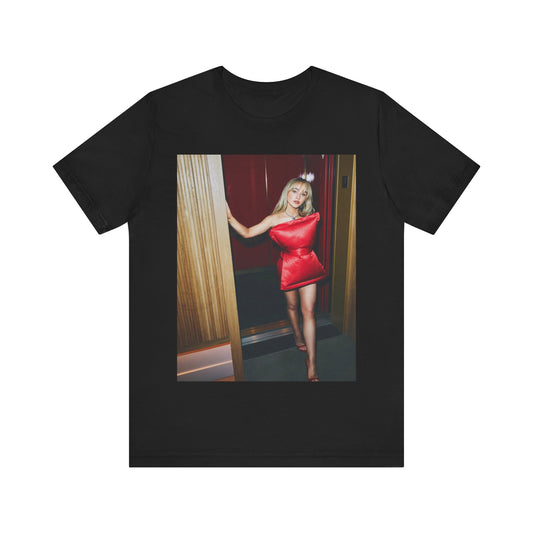 A black graphic t-shirt featuring a graphic of Sabrina Carpenter with 'hot pop vibes'.