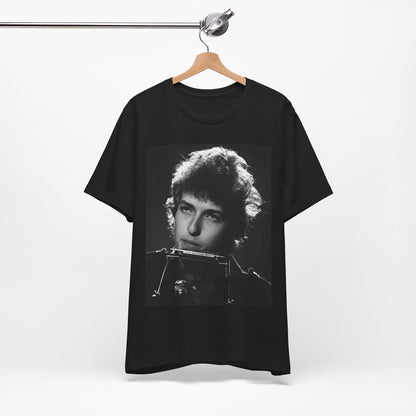 A black graphic t-shirt featuring a graphic of Bob Dylan from the 60s playing his harmonica.