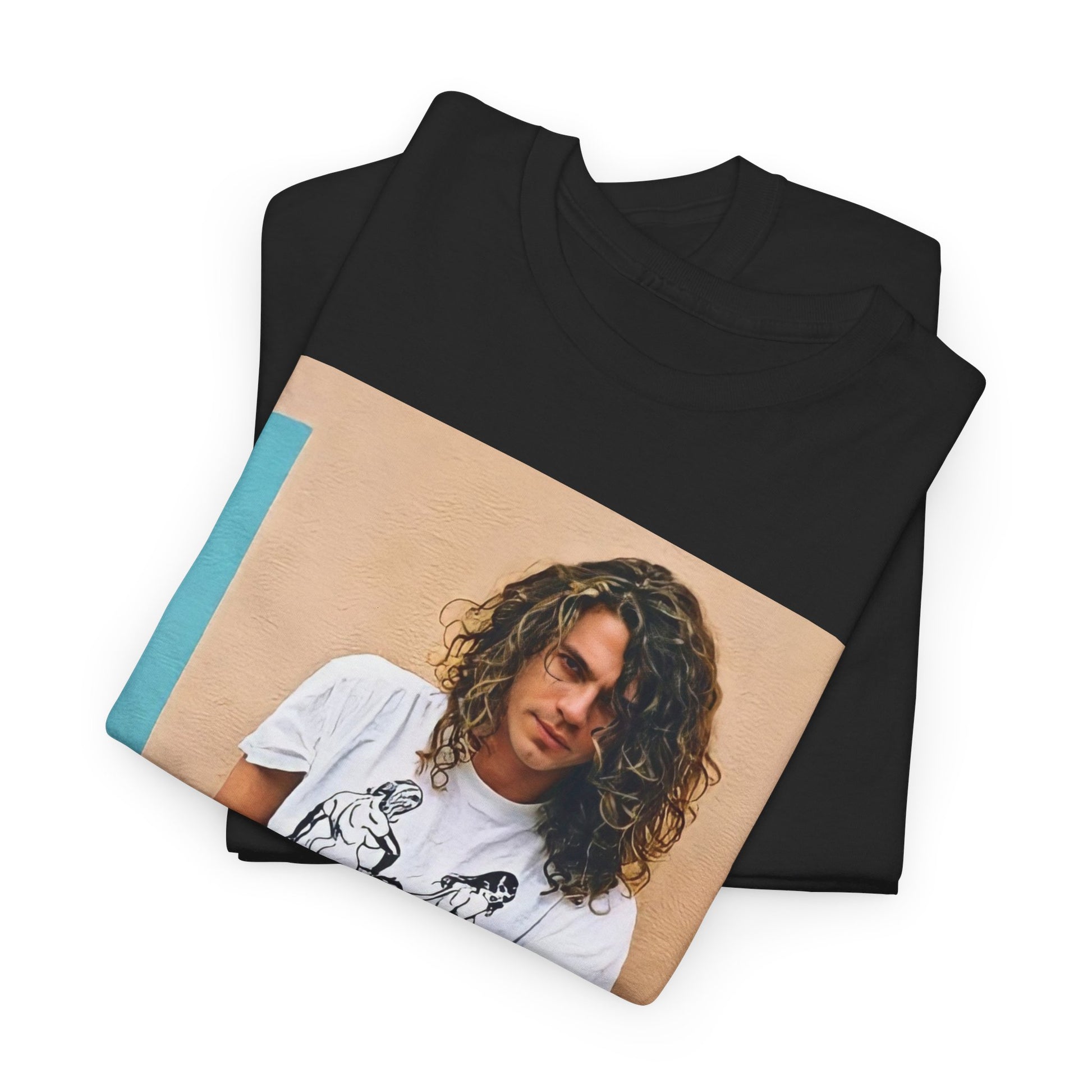 A black graphic t-shirt featuring a 90s chill retro rock graphic of INXS.