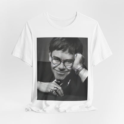 A black graphic t-shirt featuring a retro black and white photo portrait of Elton John.