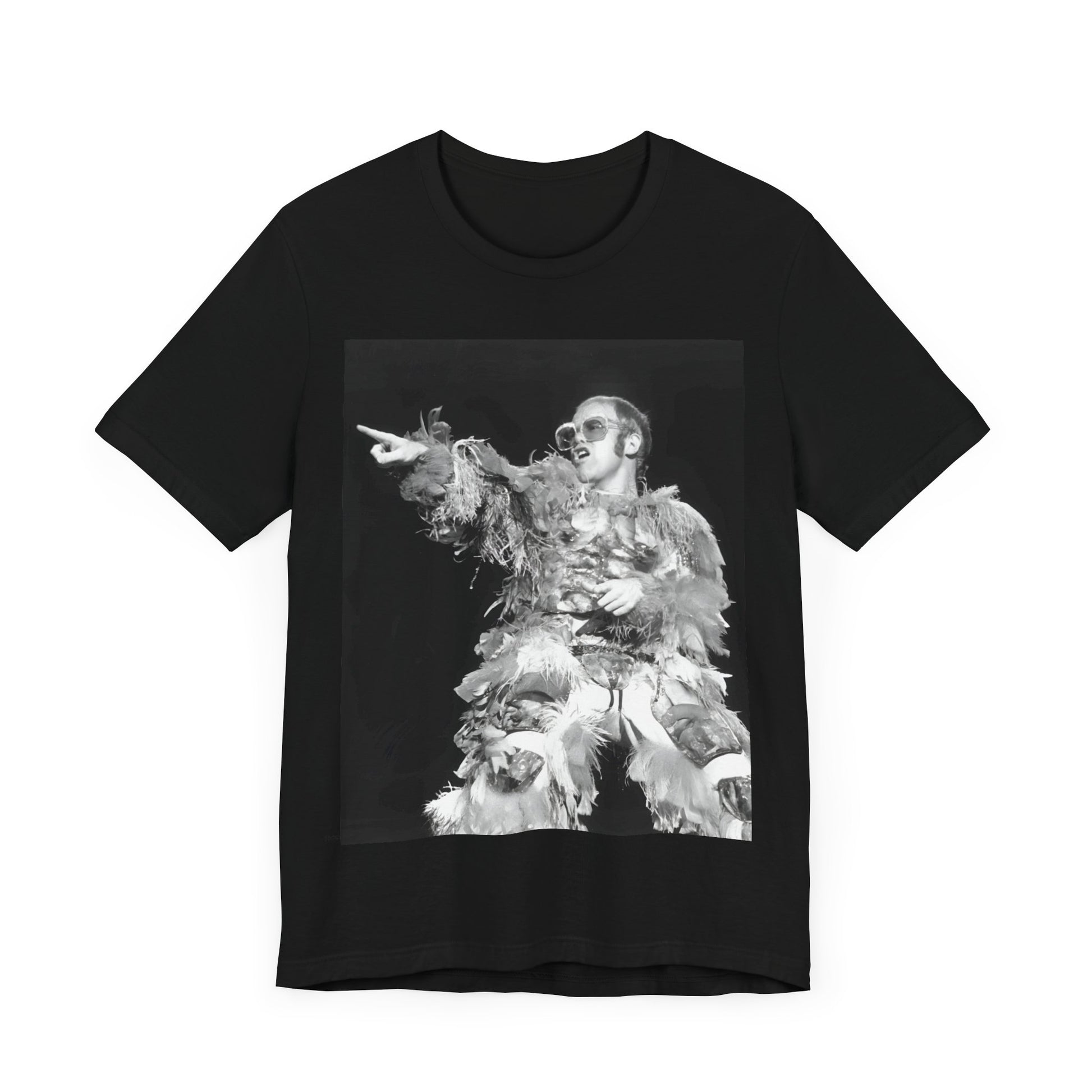 A black graphic t-shirt featuring a retro graphic of Elton John as a rock legend performing live.