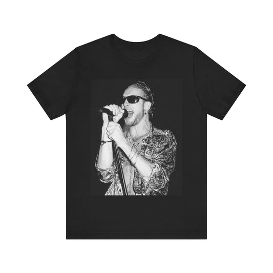 A black graphic t-shirt featuring an iconic black and white portrait photo of Layne Staley from Alice In Chains, showing his distinctive look.