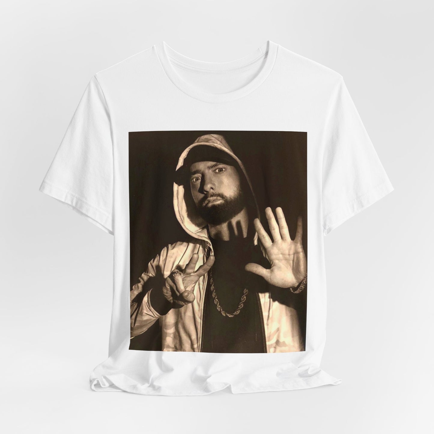 A black graphic t-shirt featuring a graphic of Eminem as an authentic underground rap icon.