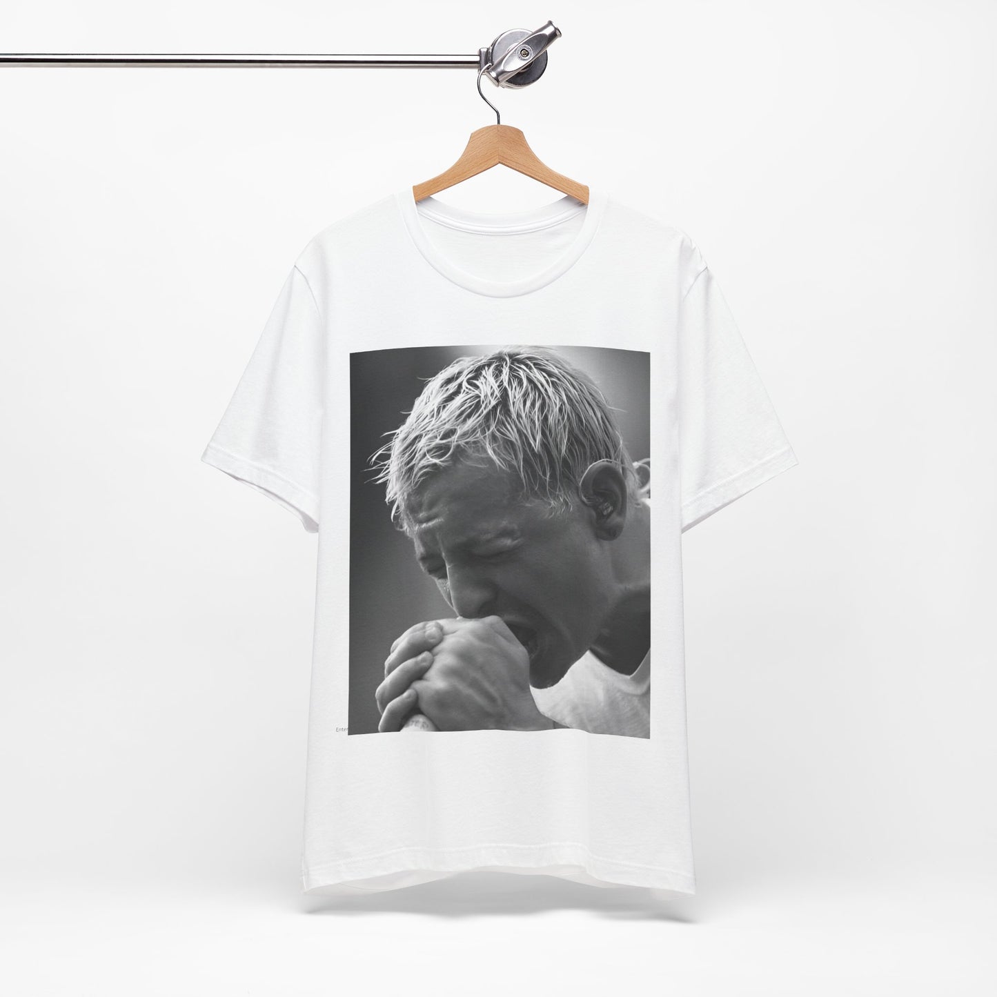 A black graphic t-shirt featuring a graphic or photo of Chester Bennington from Linkin Park performing live on stage.