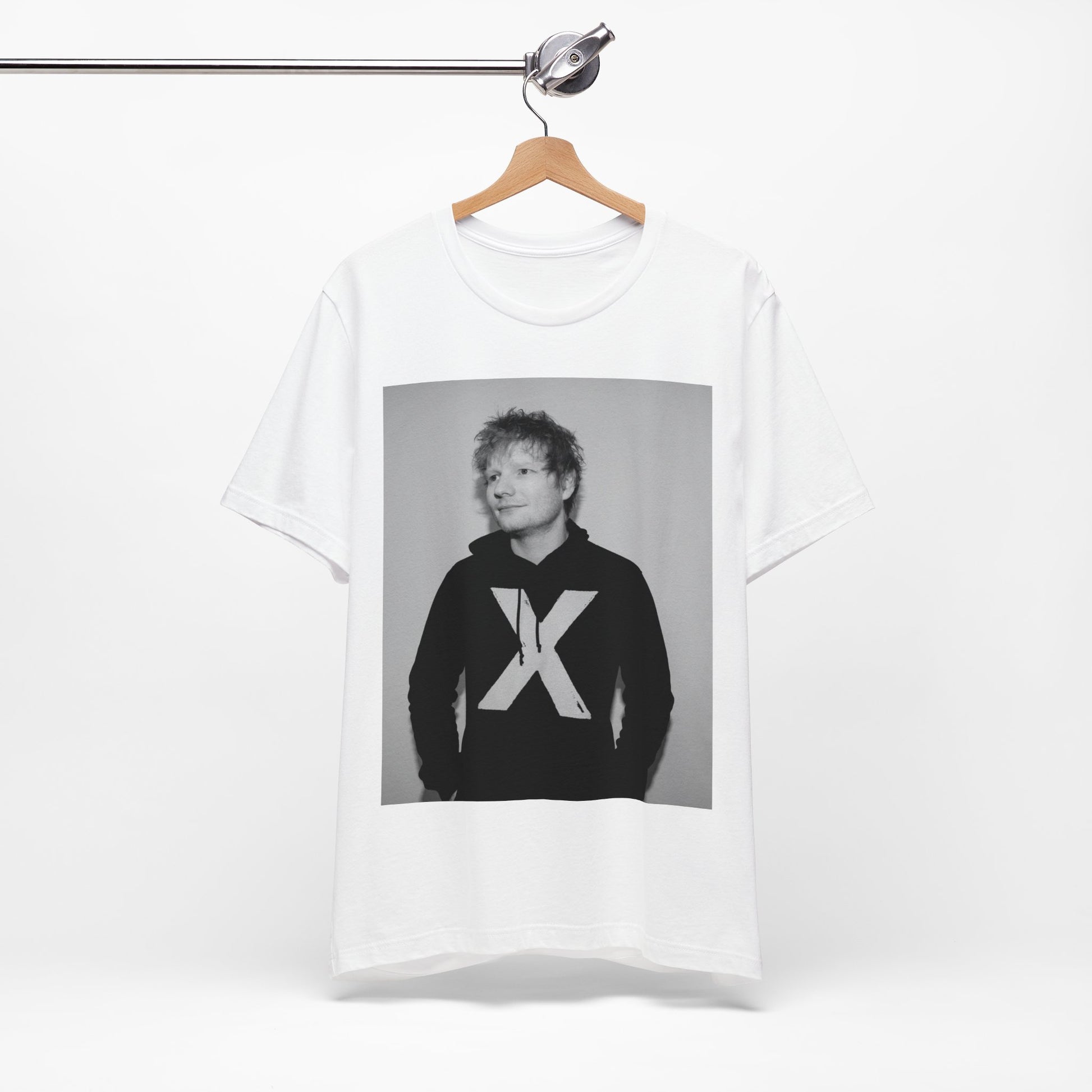 A black graphic t-shirt featuring a black and white graphic related to Ed Sheeran's album 'X'.