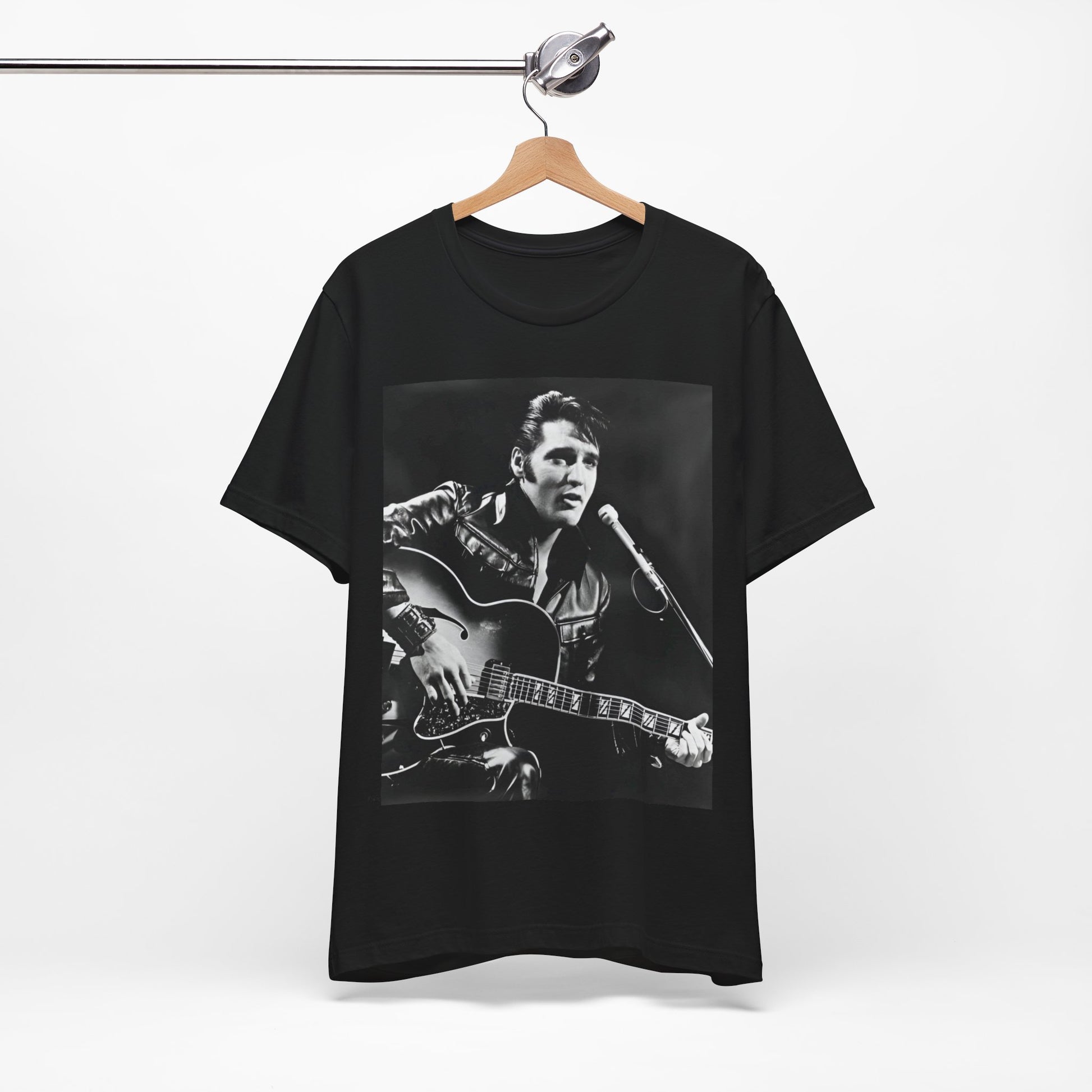 A black graphic t-shirt featuring a graphic related to Elvis Presley's 'Burning Love' song or era.