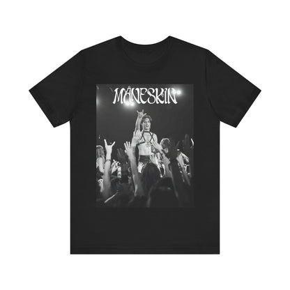 A black graphic t-shirt featuring a graphic or photo of Maneskin performing live.