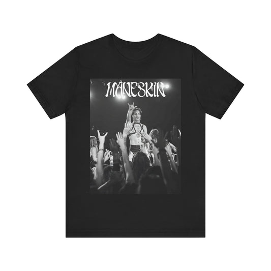 A black graphic t-shirt featuring a graphic or photo of Maneskin performing live.