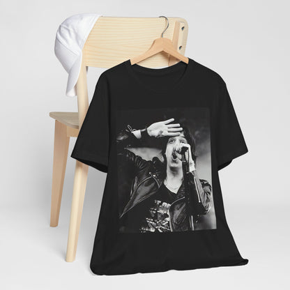 A black graphic t-shirt featuring a black and white portrait photo of The Strokes band.