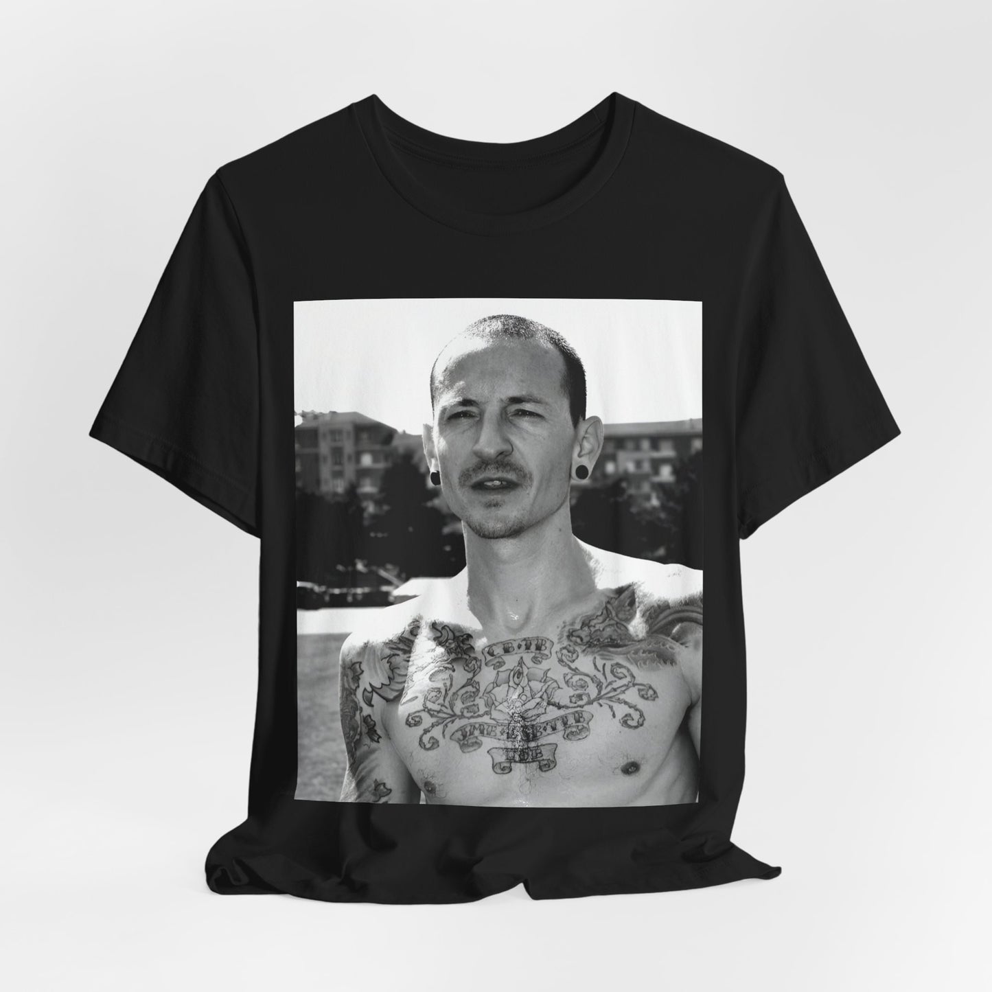 A black graphic t-shirt featuring a black and white graphic or photo portrait of Chester Bennington from Linkin Park.