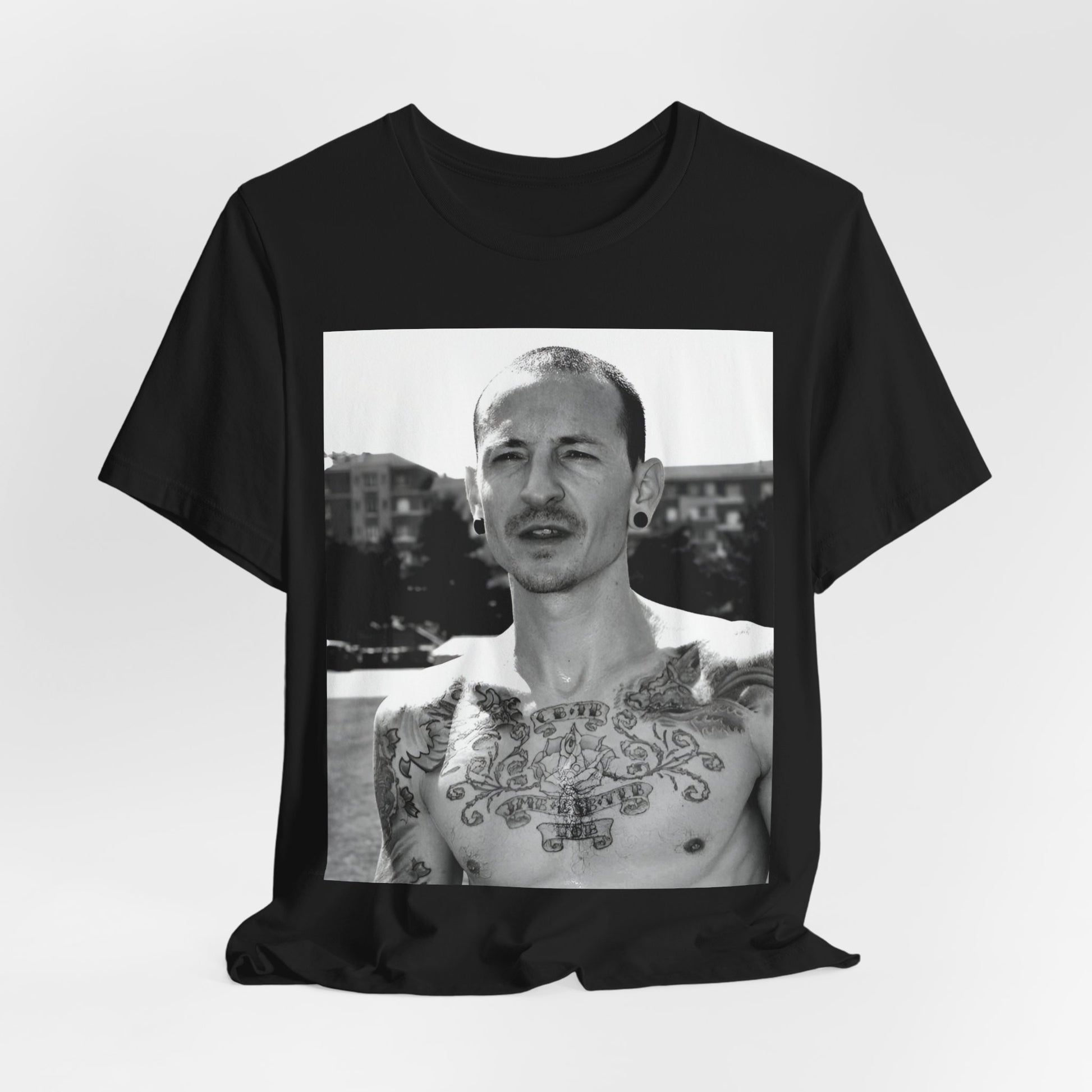 A black graphic t-shirt featuring a black and white graphic or photo portrait of Chester Bennington from Linkin Park.