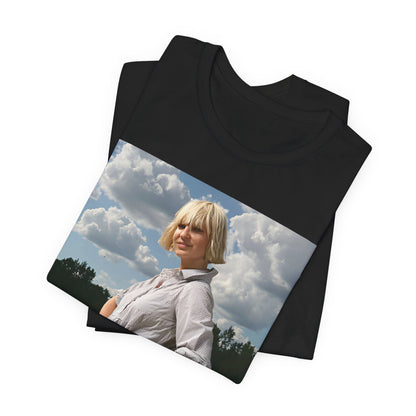 A black graphic t-shirt featuring a bold graphic of Sia as a pop superstar.