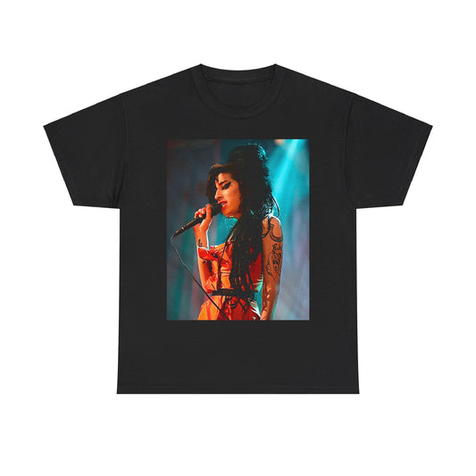 A black graphic t-shirt featuring a photo of Amy Winehouse performing live on stage in 2007, with her signature beehive and expressive singing.