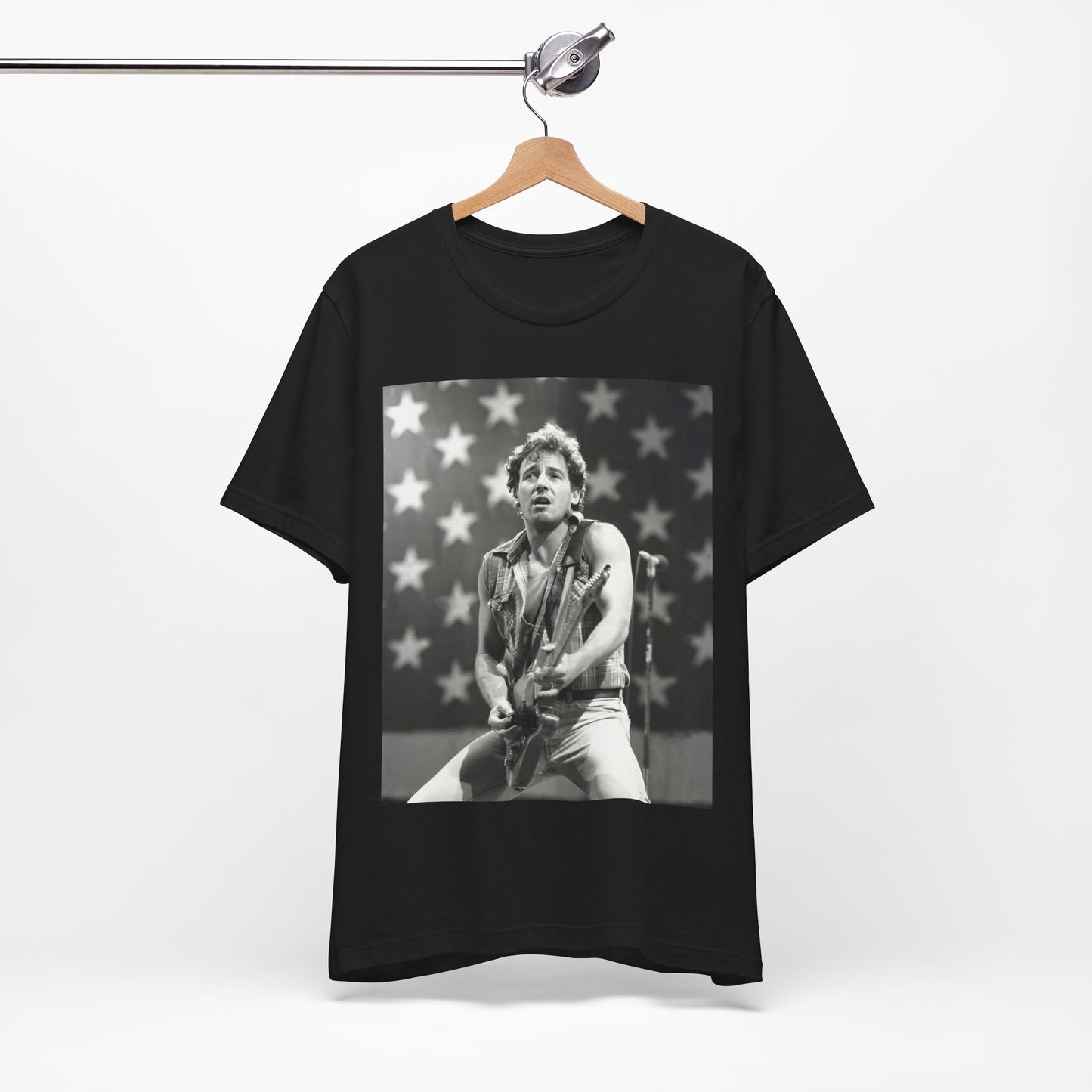 A black graphic t-shirt featuring a black and white graphic of Bruce Springsteen with an American flag background or elements.