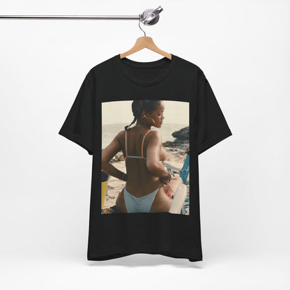 A black graphic t-shirt featuring a graphic of Rihanna as a bikini babe in paradise.