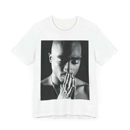 A black graphic t-shirt featuring a black and white streetwear rebel graphic of Tupac.