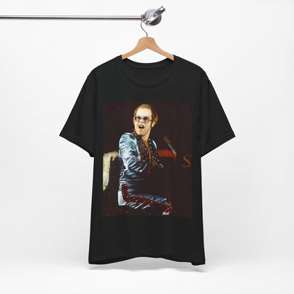 A black graphic t-shirt featuring a retro graphic related to Elton John's 'Rocket Man' song or era.