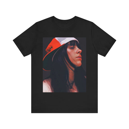 A graphic t-shirt featuring the name 'Billie Eilish' in a raw, urban street-style font.