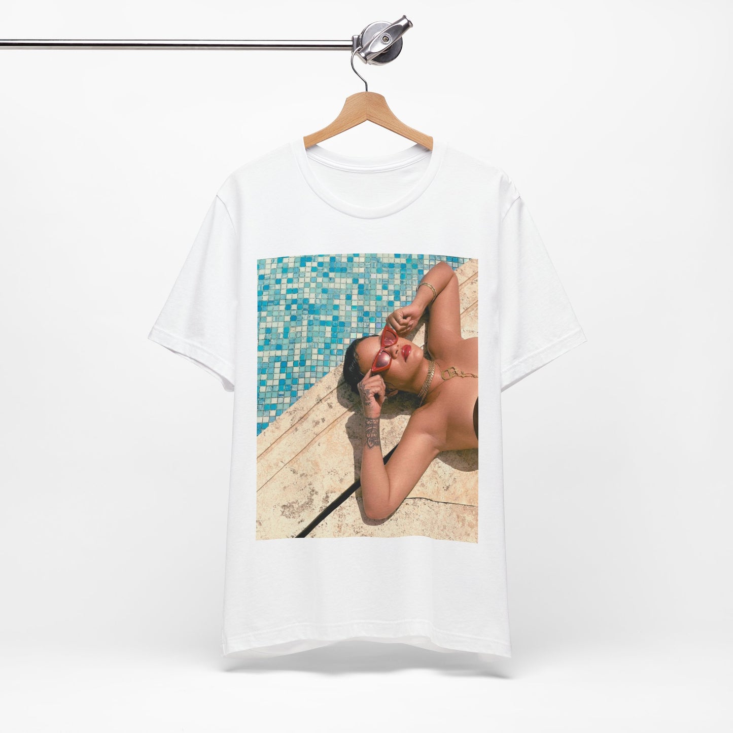 A black graphic t-shirt featuring a graphic of Rihanna in swimwear as a pop star queen.