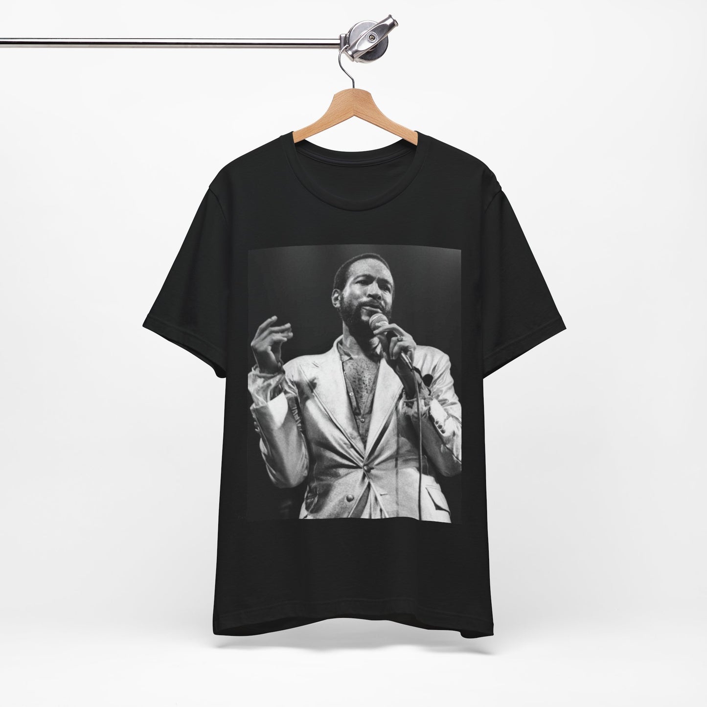 A black graphic t-shirt featuring a retro black and white photo or graphic of Marvin Gaye performing live on stage.