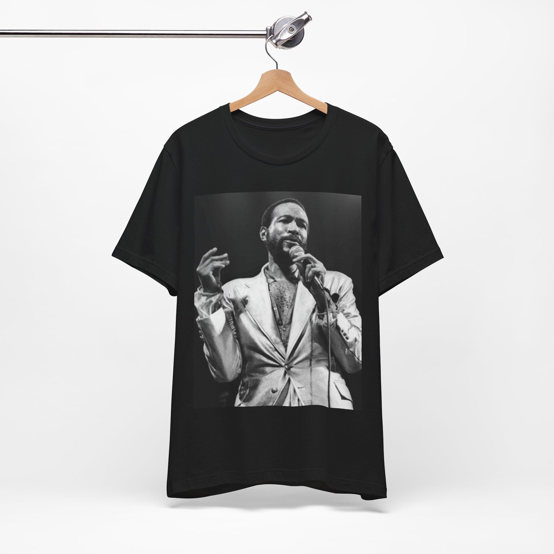 A black graphic t-shirt featuring a retro black and white photo or graphic of Marvin Gaye performing live on stage.
