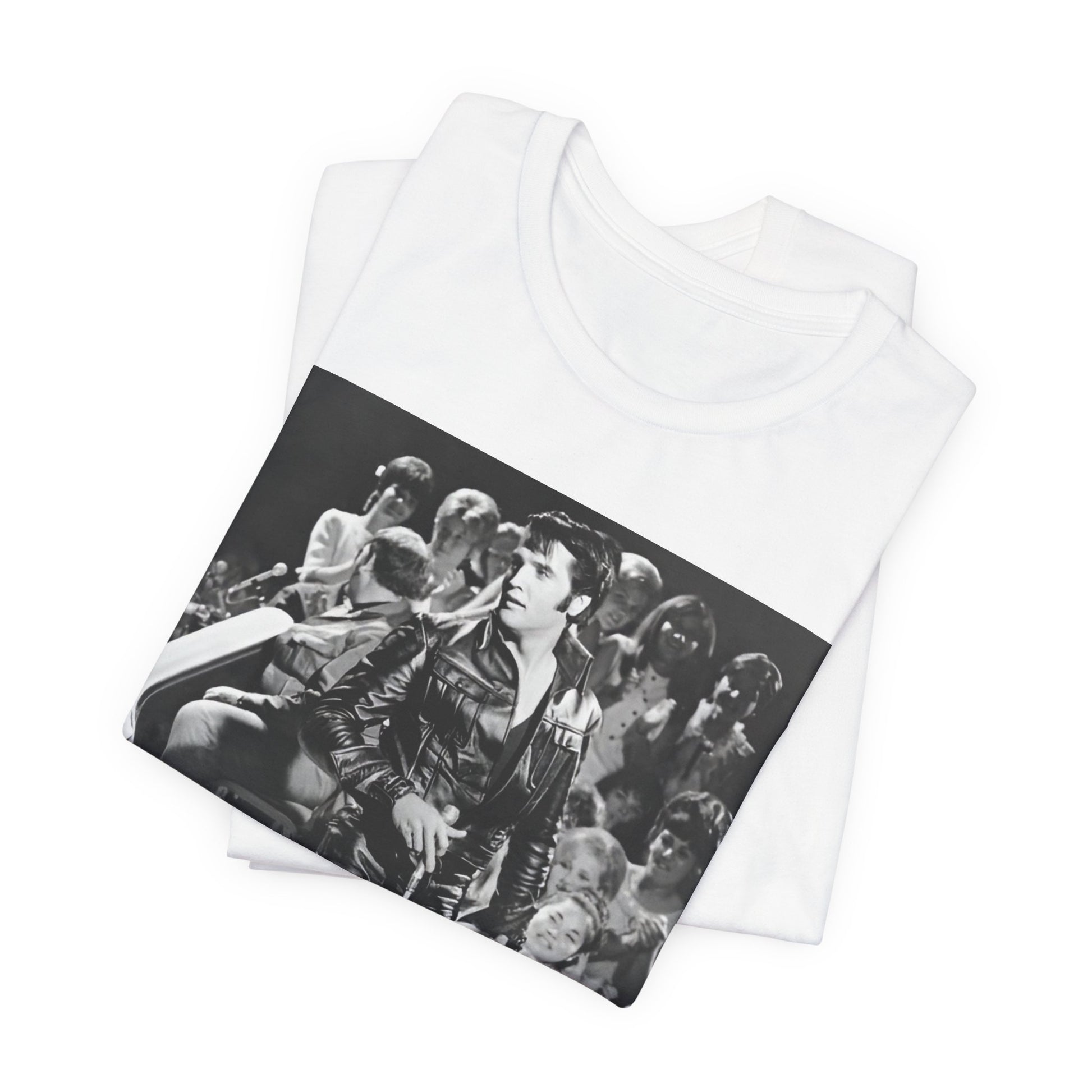 A black graphic t-shirt featuring a vintage black and white photo or graphic of Elvis Presley performing live on stage.