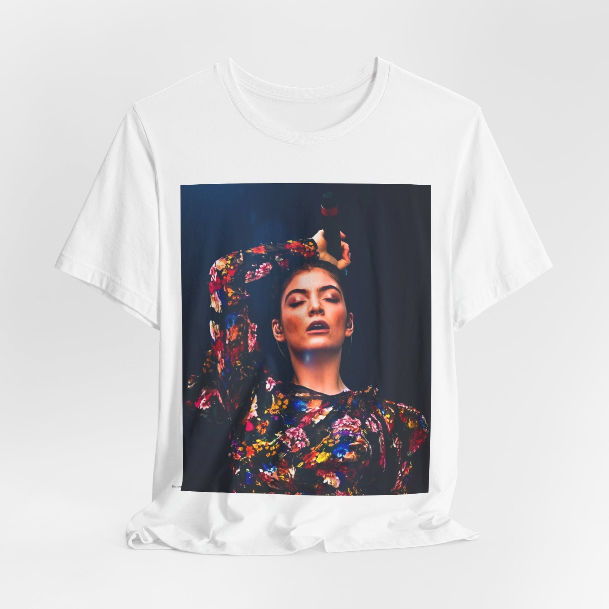 A black graphic t-shirt featuring a retro graphic related to Lorde's 'Pure Heroine' album era.