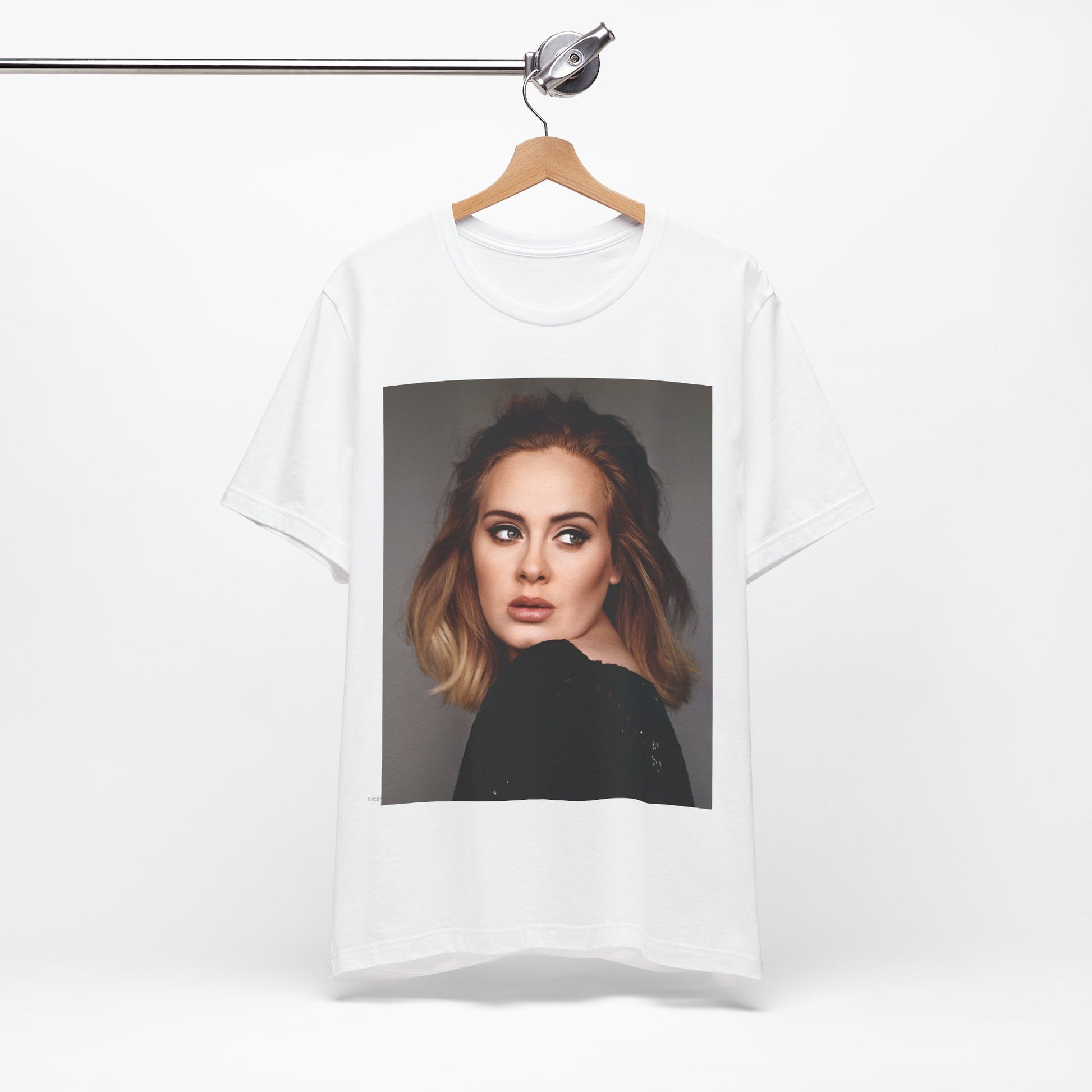 A black graphic t-shirt featuring a studio portrait of Adele from her '25' album era, showing a thoughtful or serene expression.
