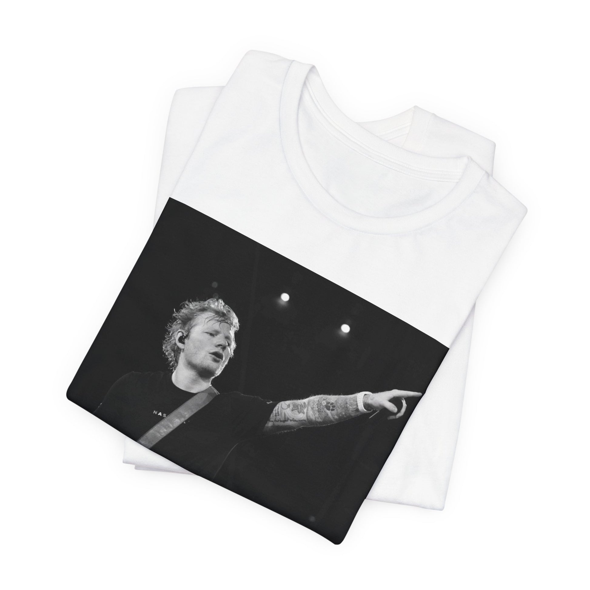 A black graphic t-shirt featuring a black and white graphic or photo of Ed Sheeran performing live on stage.