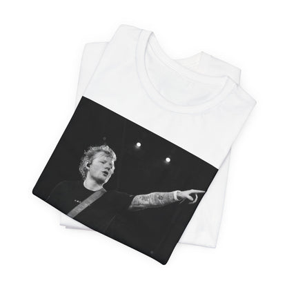 A black graphic t-shirt featuring a black and white graphic or photo of Ed Sheeran performing live on stage.