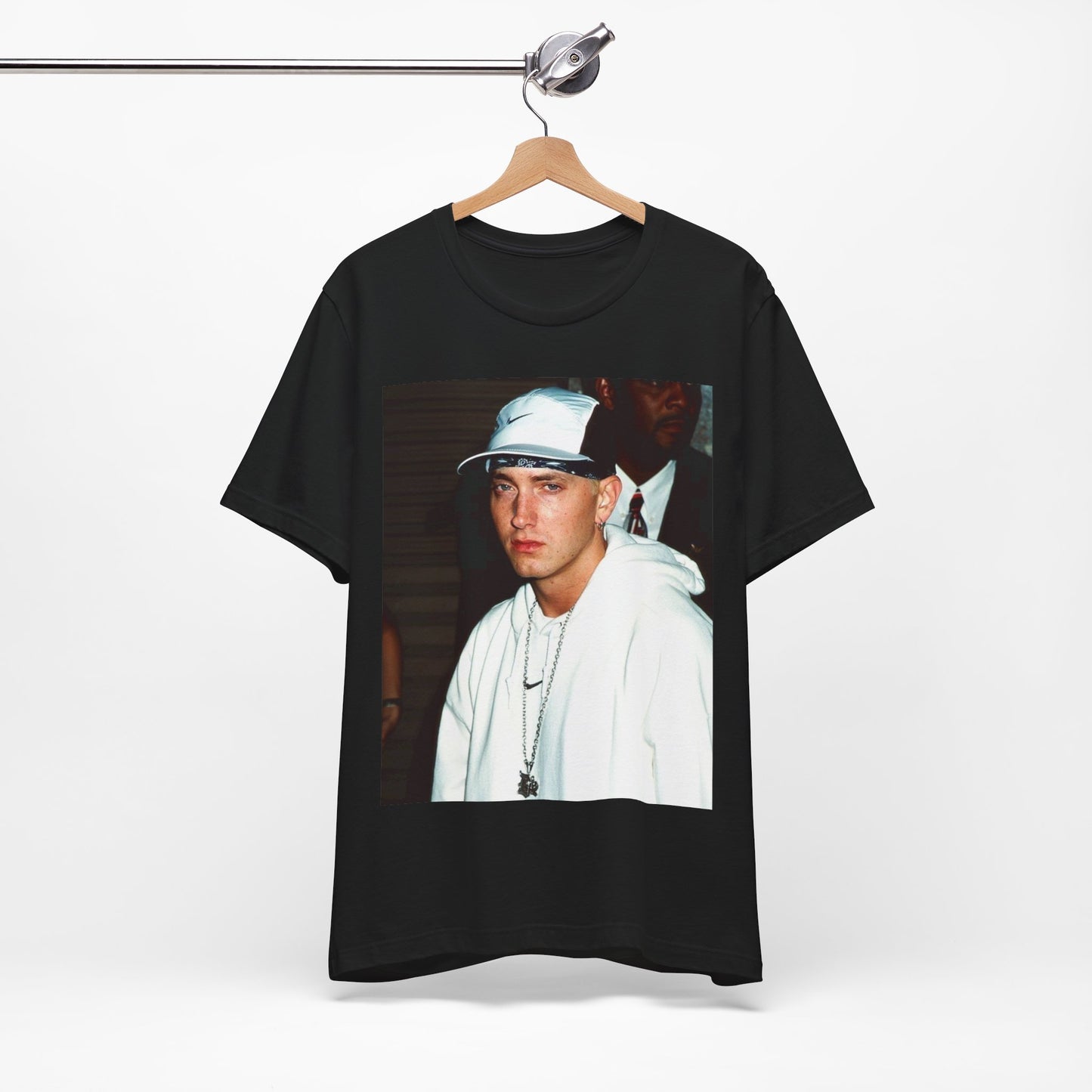 A black graphic t-shirt featuring a retro graphic or photo of Eminem in a backstage setting.