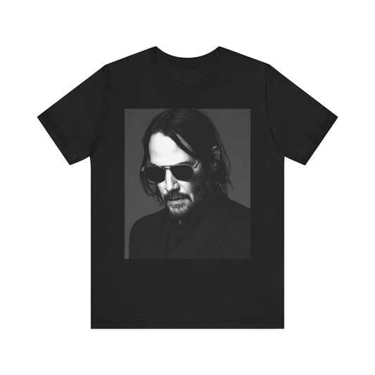 A black graphic t-shirt featuring a graphic of Keanu Reeves with a rebel spirit aesthetic.