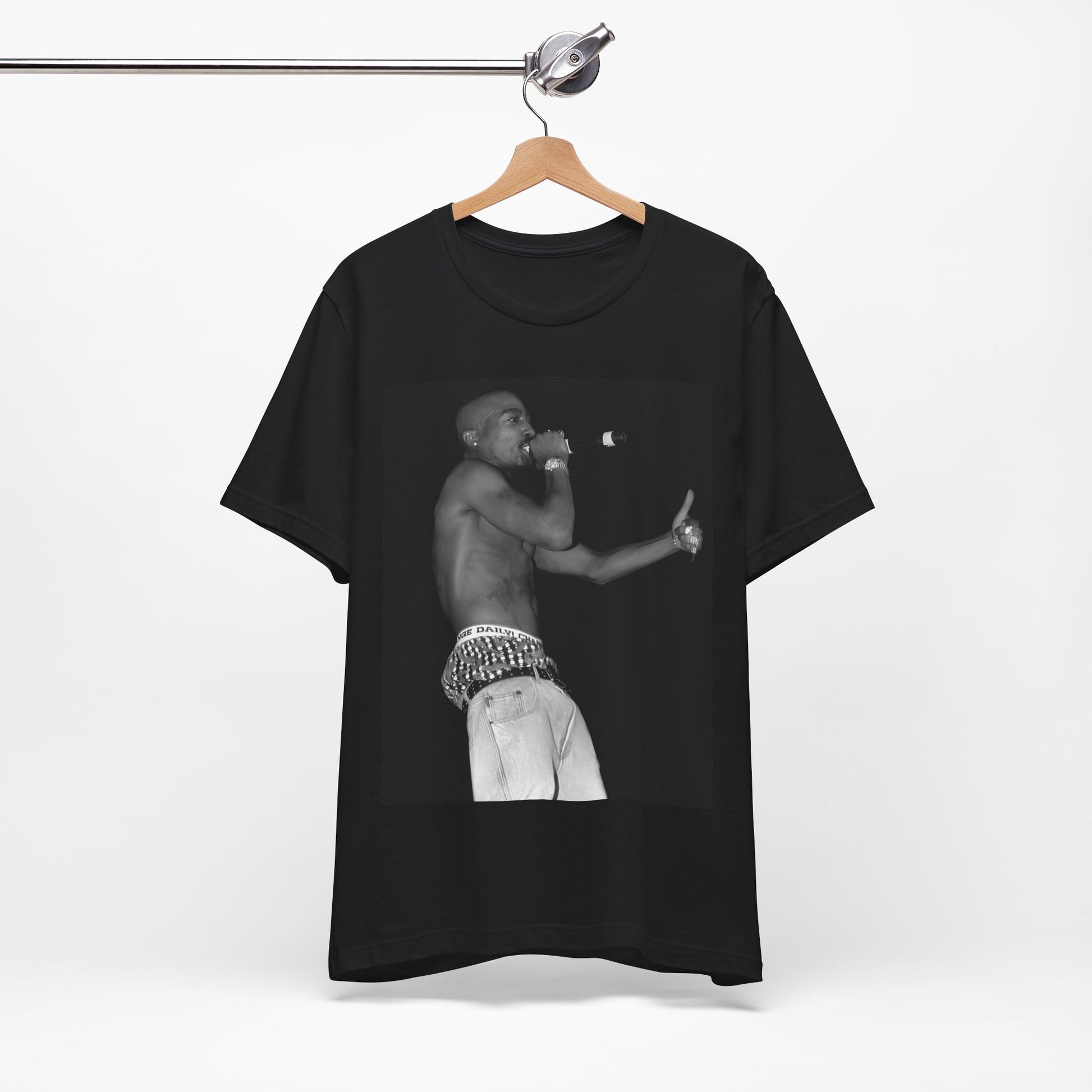 A black graphic t-shirt featuring a graphic of Tupac as a justice fighter.